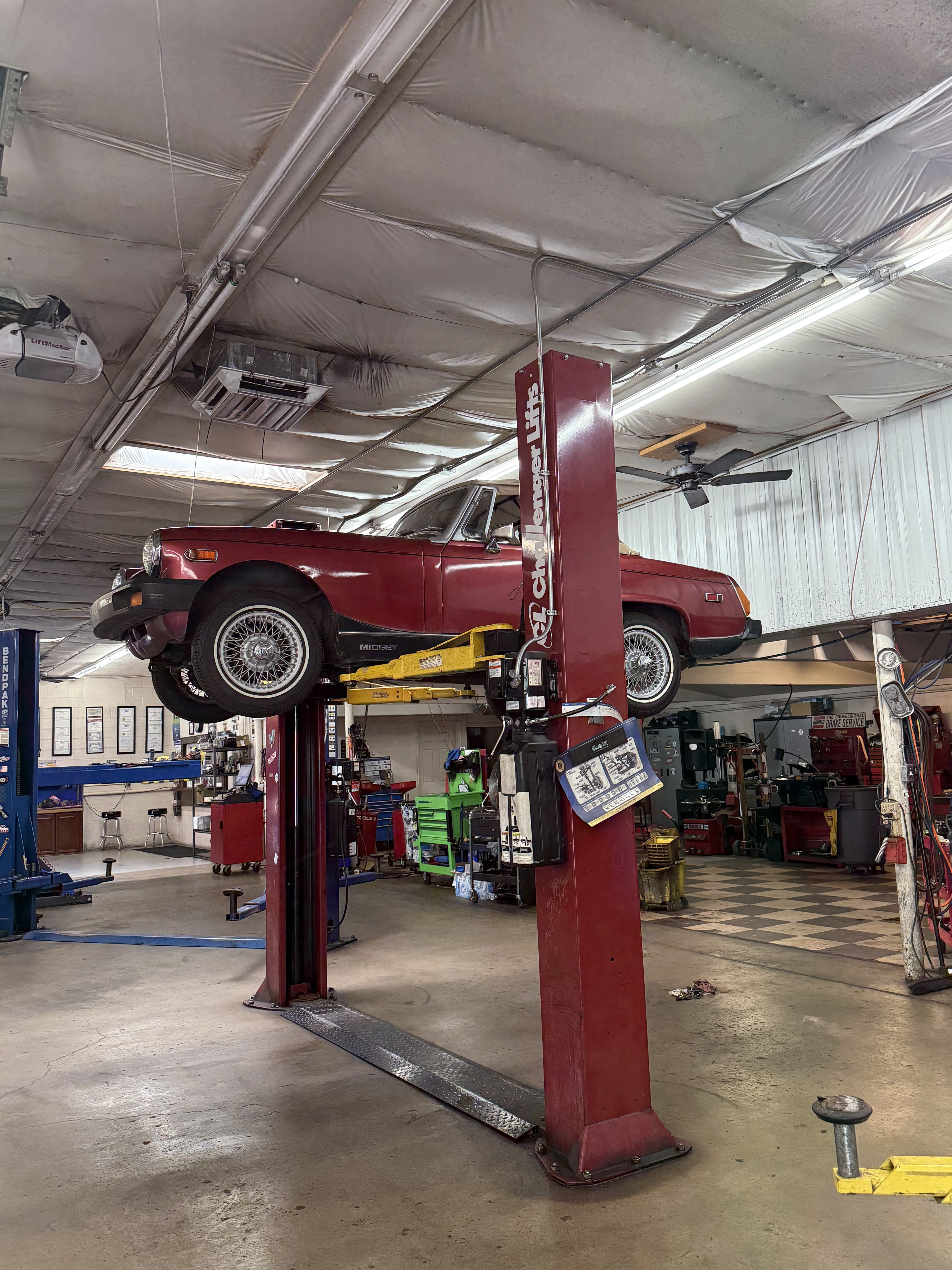 Classic car on lift at Lucas Auto