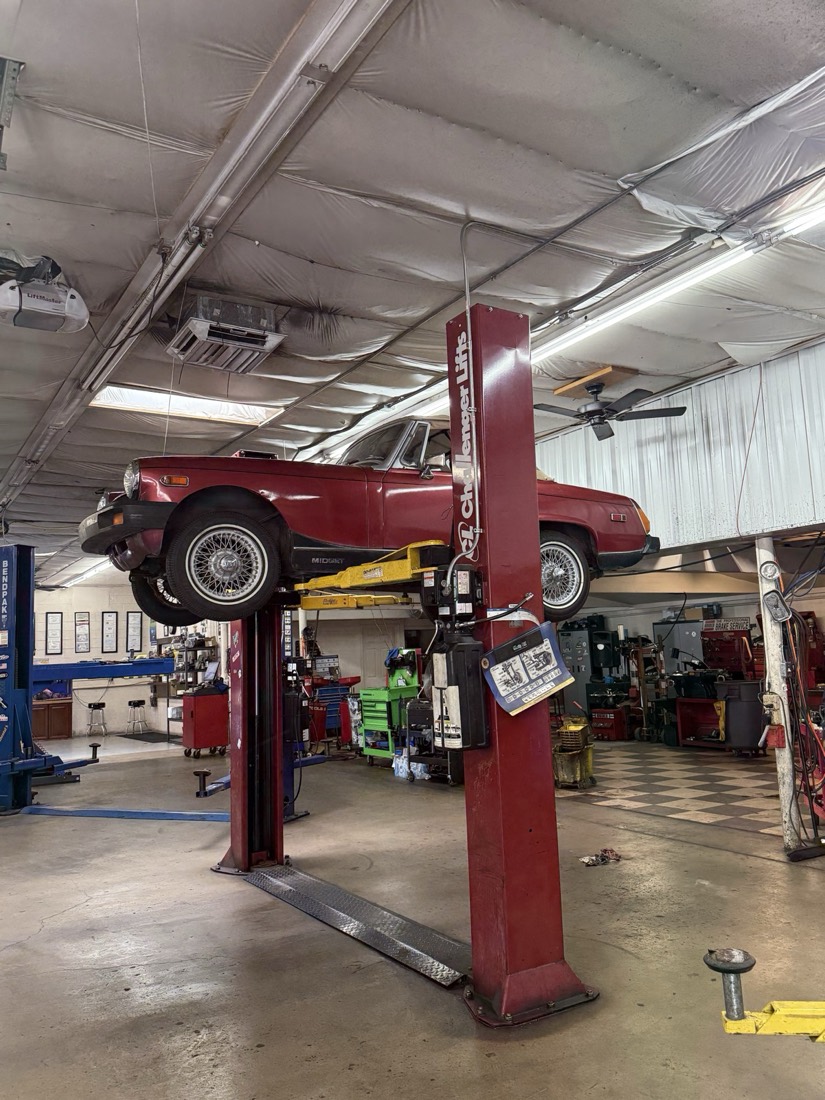 Classic car on lift at Lucas Auto
